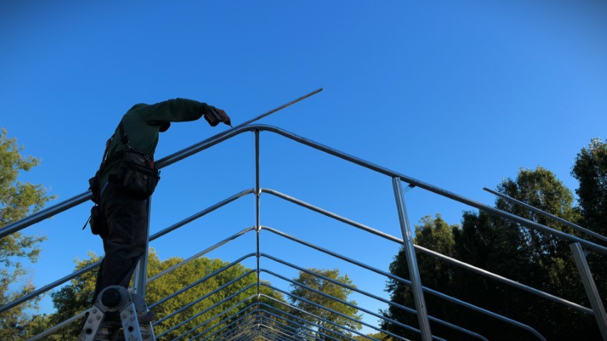 High Tunnel HoopHouse Install Wire Lock Channel