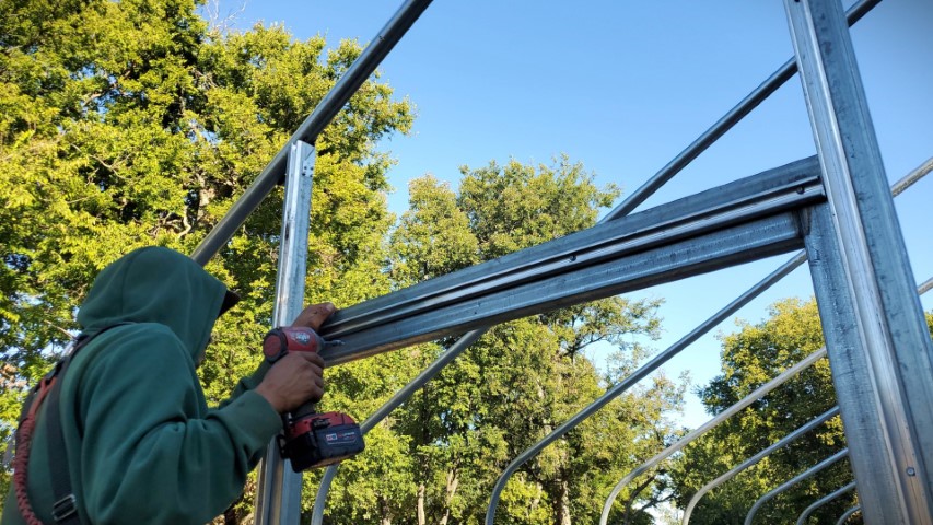 High Tunnel HoopHouse Install Wire Lock Channel