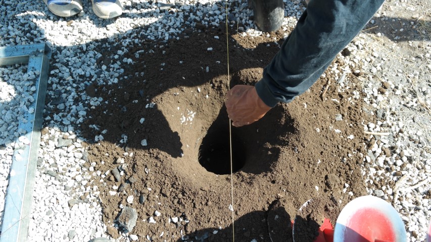 Dig post holes for end wall